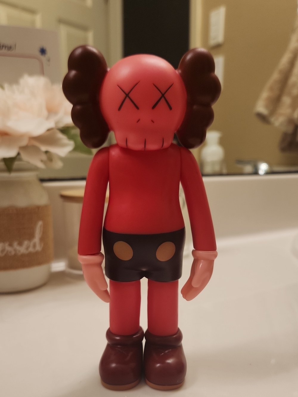 KAWS Red Vinyl Figure with Brown Ears and Black Shorts